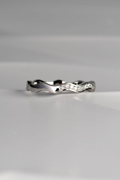 Modern wavy platinum ring set with diamonds that can be stacked with other rings. This ring is handmade in the UK.
