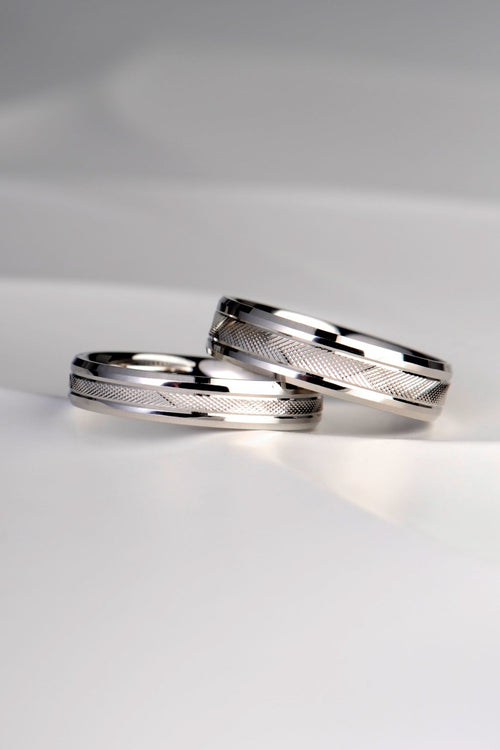 modern affordable wedding rings with textured cross hatch engraving and chamfered edge made in the UK and available to order in different widths