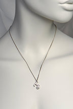 designer white gold initial necklace set with a diamond by Christine Sadler