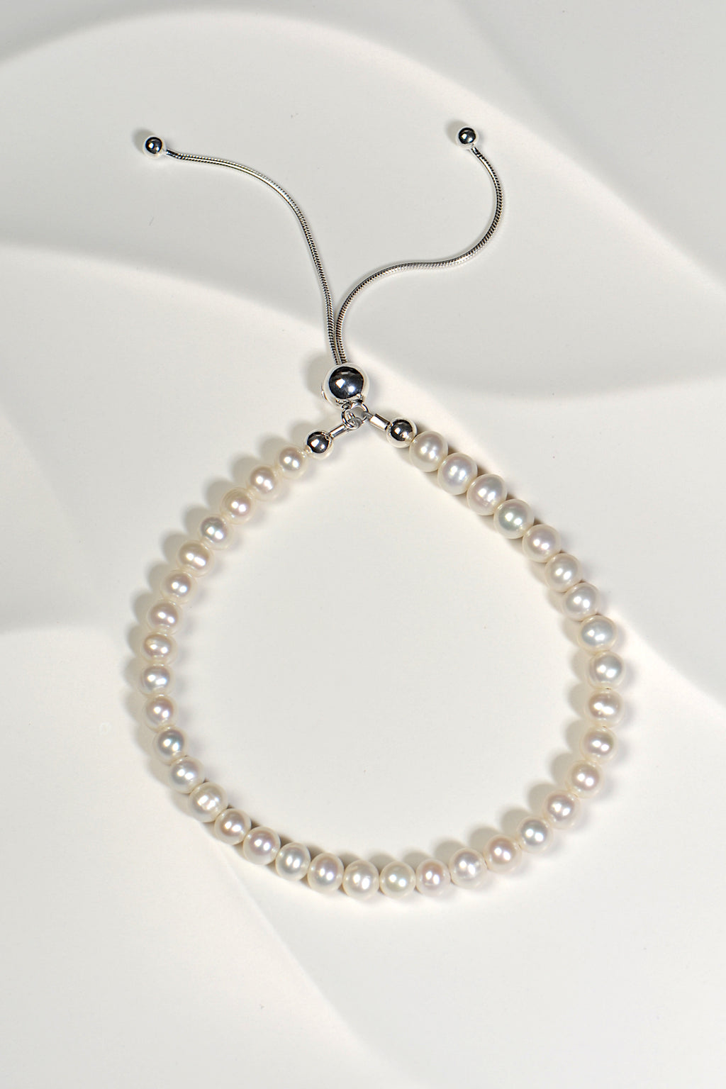 real pearl bracelet with an adjustable silver slider clasp