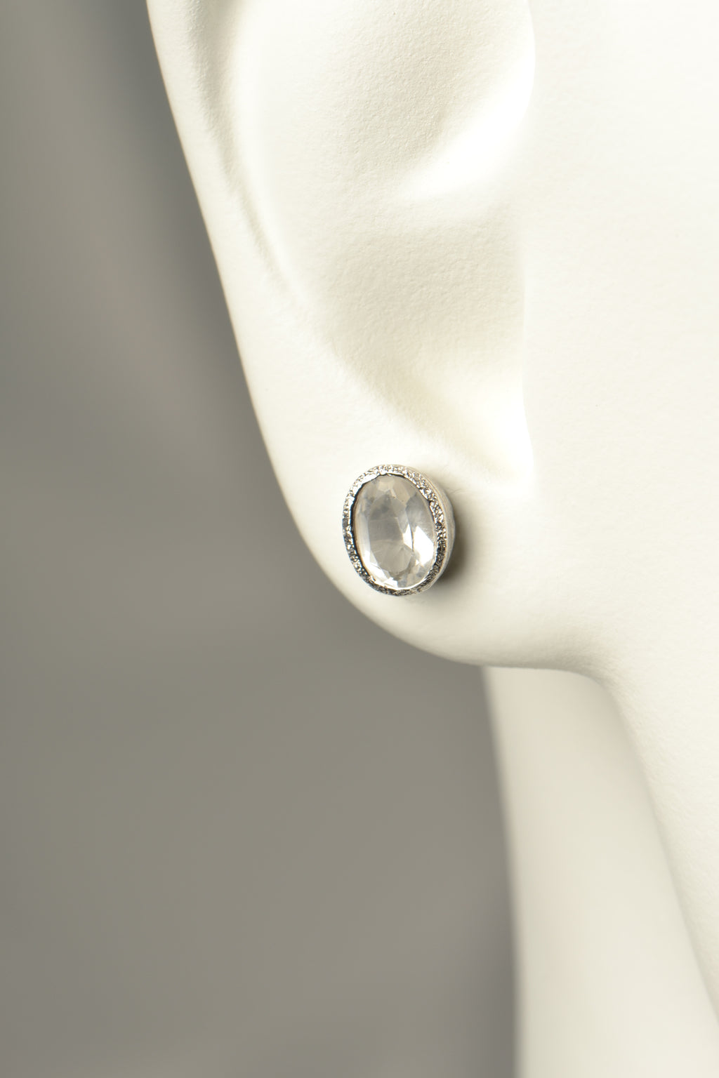 affordable designer silver stud earrings set with white topaz which is an alternative gemstone for an April birthstone