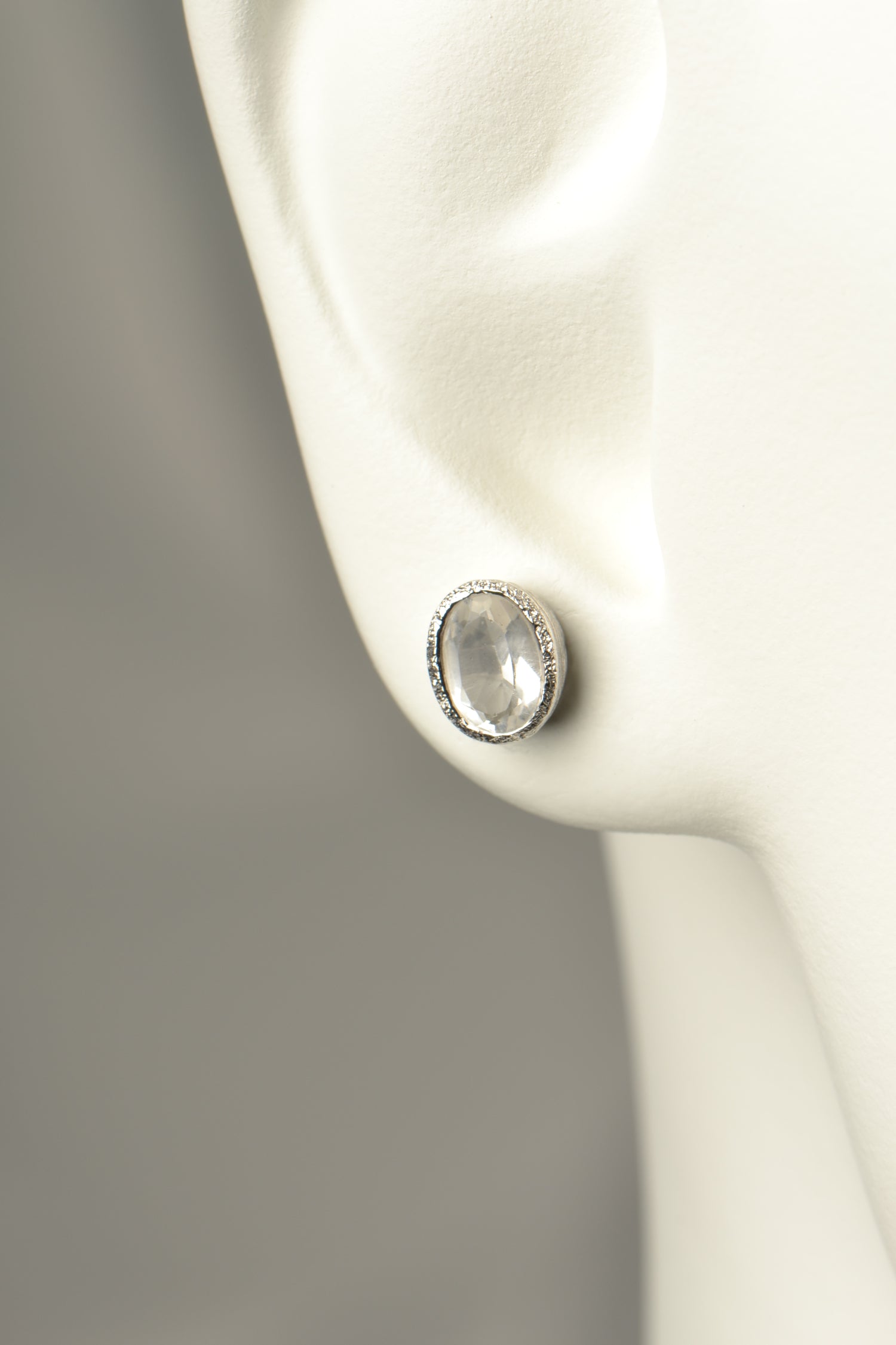 affordable designer silver stud earrings set with white topaz which is an alternative gemstone for an April birthstone
