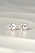 designer silver April birthstone earrings