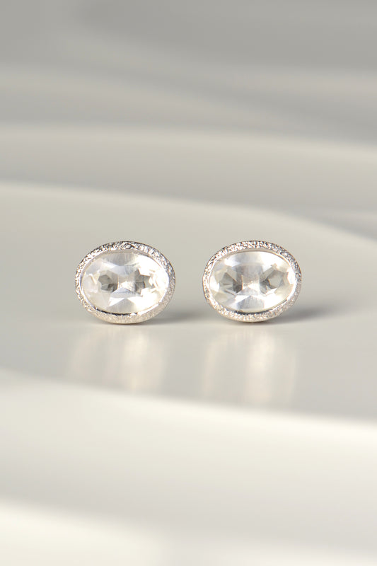 designer silver April birthstone earrings