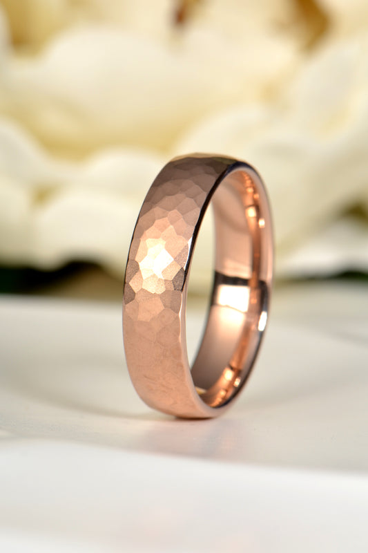 18ct rose gold gents wedding ring with hammered matt brushed finish, photographed with a white rose symbolising timeless love – handmade in the UK by Christine Sadler Unforgettable Jewellery
