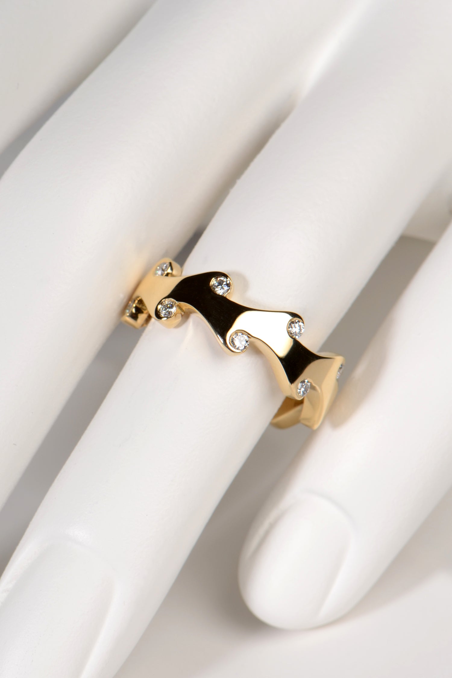 unusual 18ct yellow gold diamond ring with an unusual flame design inspired by fire. Perfect as a diamond wedding ring, diamond eternity ring or even just a special gift