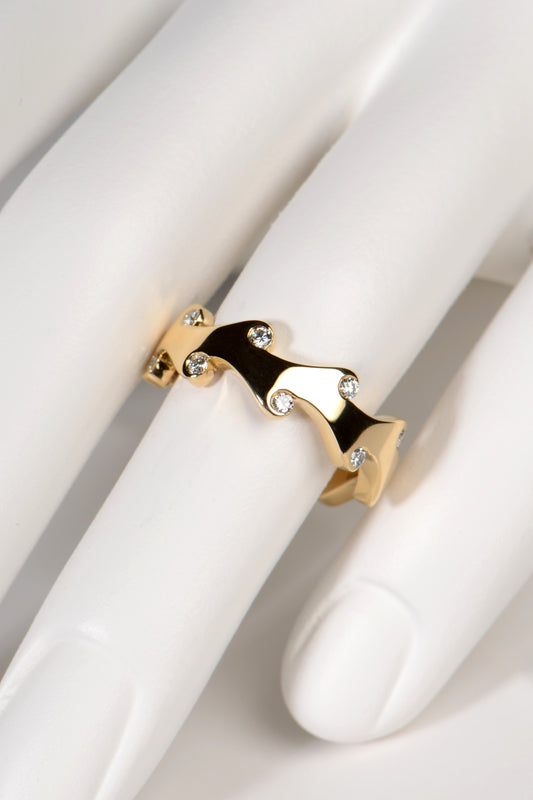 unusual 18ct yellow gold diamond ring with an unusual flame design inspired by fire. Perfect as a diamond wedding ring, diamond eternity ring or even just a special gift