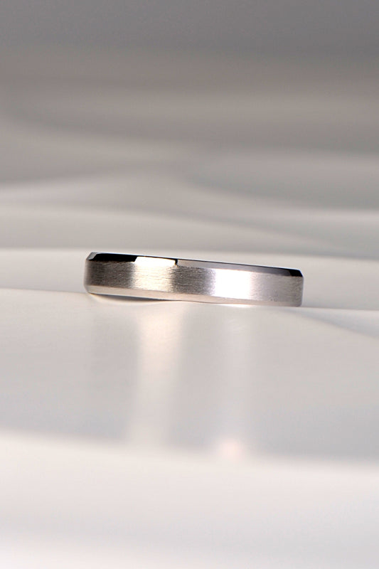 simple wedding ring for a man or woman with a modern matt finish and a polished chamfered edge