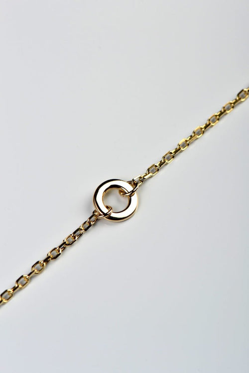 Handmade delicate gold bracelet with a circle at the front from British jewellery designer Christine Sadler