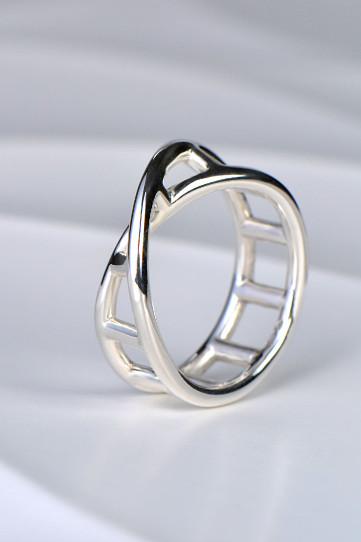 modern sculptural silver ring by UK jewellery designer Christine Sadler in a twisted DNA ladder shape