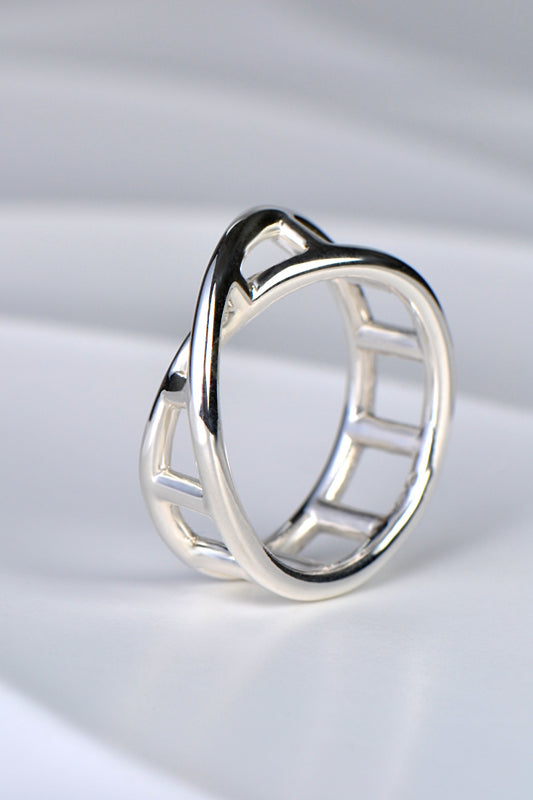 modern sculptural silver ring by UK jewellery designer Christine Sadler in a twisted DNA ladder shape