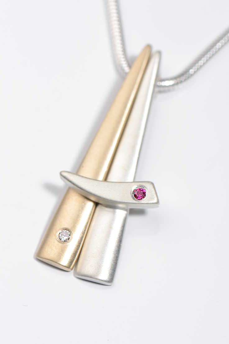 Modern handmade 9ct gold and silver ruby and diamond pendant from British jewellery designer Christine Sadler