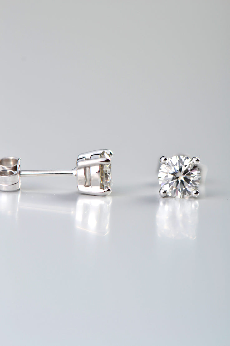 18ct white gold moissanite lab grown gemstone earrings with four claws with side view of one of the earrings