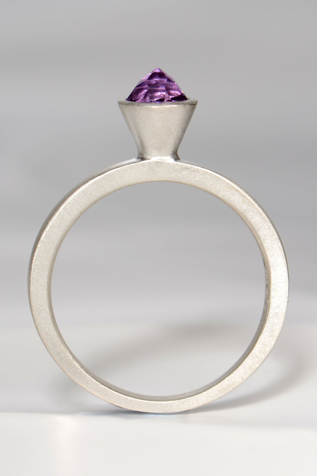 contemporary handmade silver designer ring with an amethyst gemstone. This ring is designed to look like a cupcake.