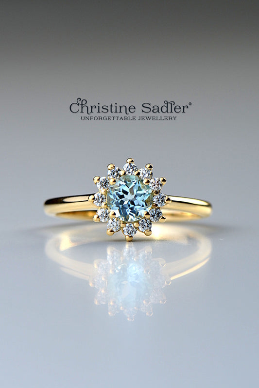 Aquamarine and diamond flower ring 18ct yellow gold