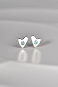 handmade silver heart earring in matt finish set with real aquamarine gemstones - on a white background