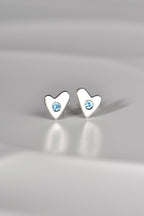 handmade silver heart earring in matt finish set with real aquamarine gemstones - on a white background