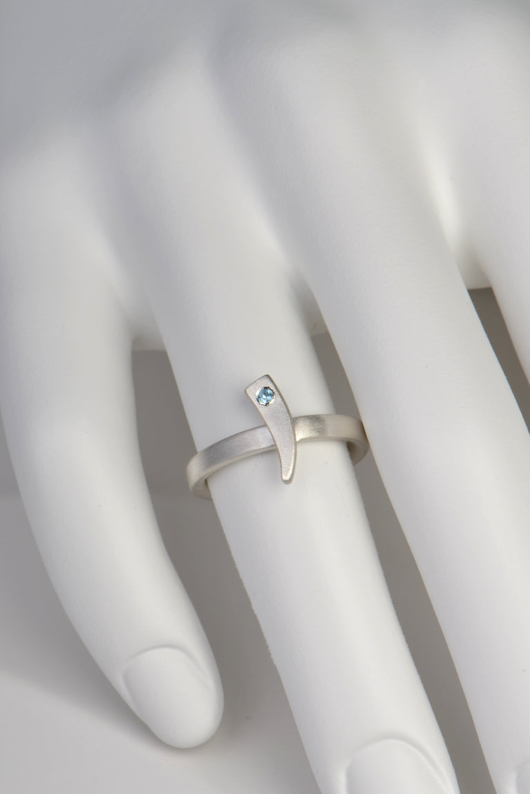 Cairn stacking rings with diamond and blue topaz