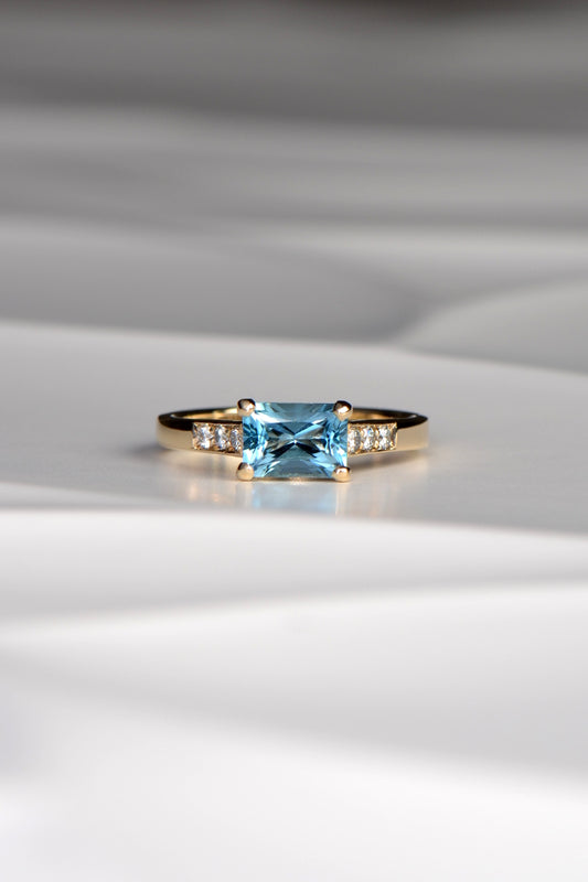 Blue topaz and diamond radiant ring.