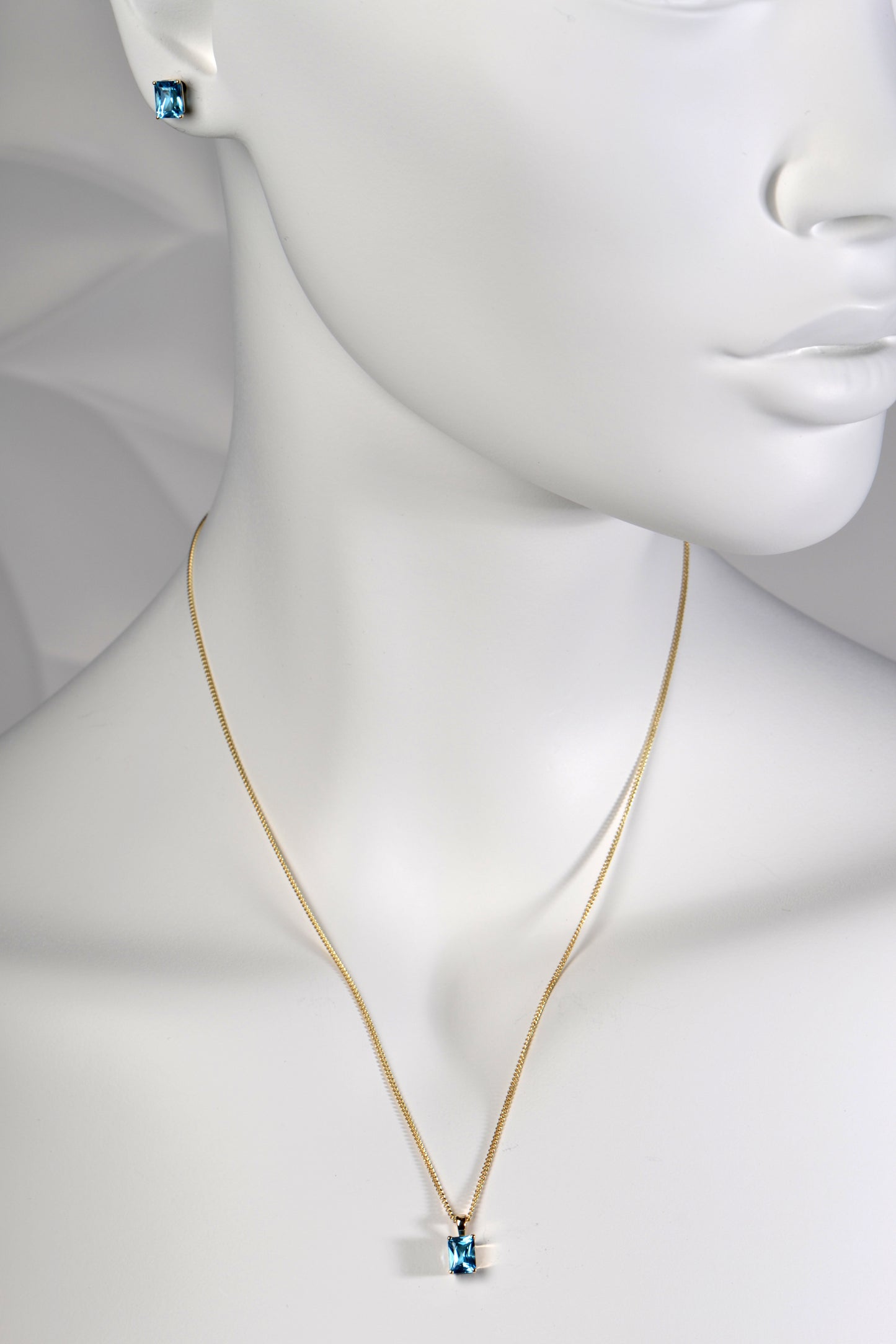 Radiant cut blue topaz gold necklace