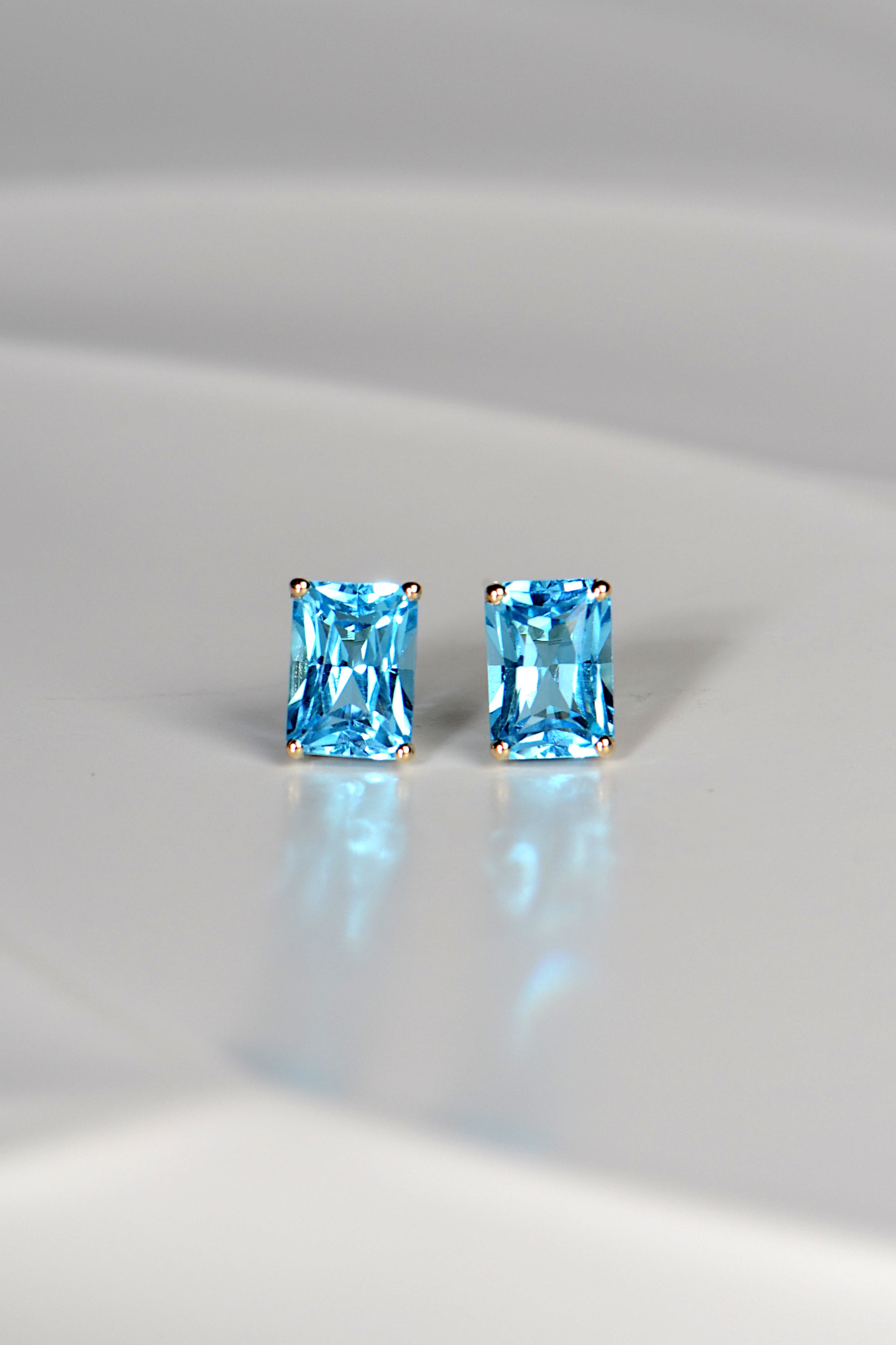 high quality swiss blue topaz stud earrings in yellow gold Christine Sadler jewellery Ayr