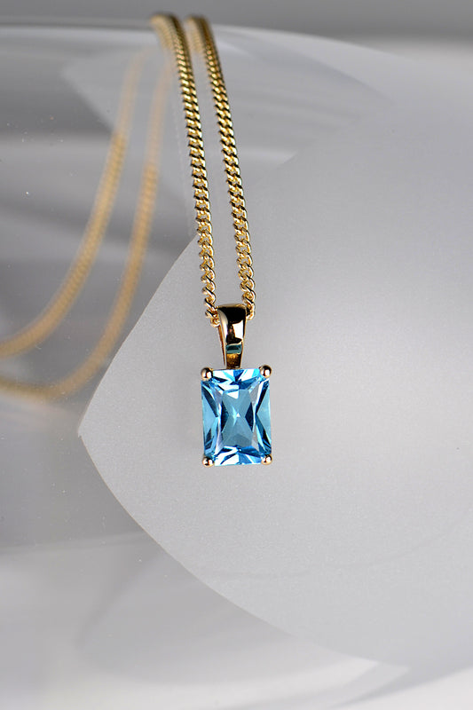 Radiant cut blue topaz gold necklace