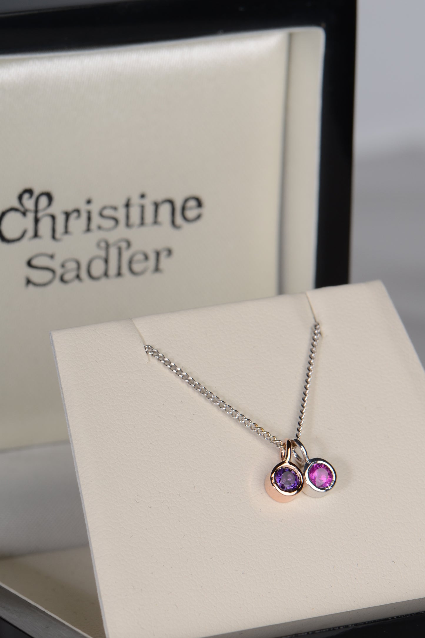 Cairn gold pendant with amethyst and pink sapphire