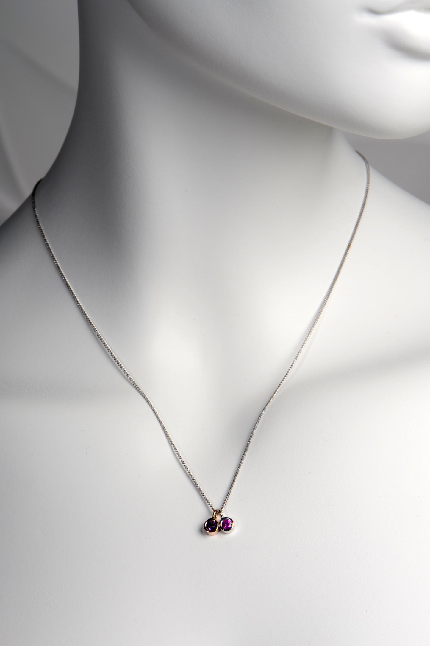 Cairn gold pendant with amethyst and pink sapphire