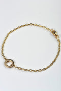 A real gold delicate bracelet with a gold circle at the front in the chain from British jewellery designer Christine Sadler