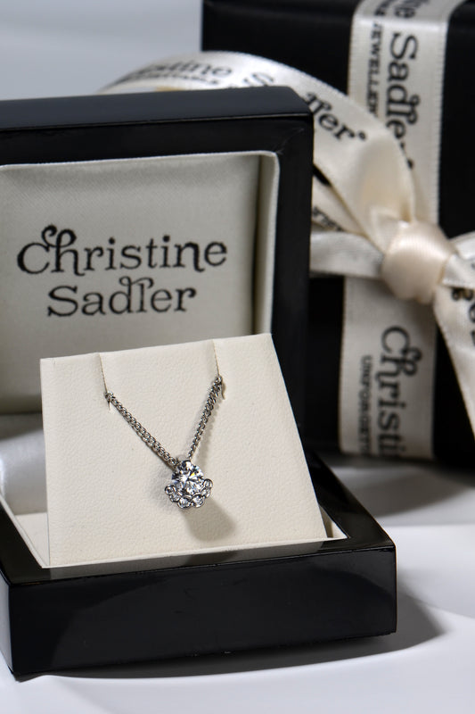 exclusive and different platinum lab diamond necklace from Christine Sadler photographed in a presentation box with branded  gift wrapping