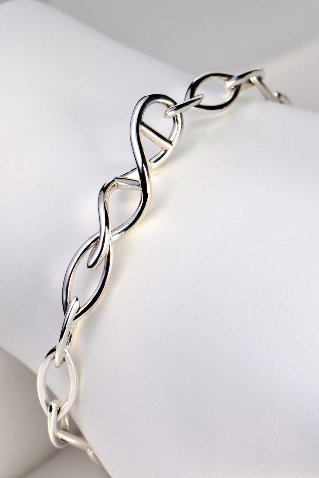 Sterling silver designer genes handmade bracelet with DNA helix link at the front and alternating elliptical links in 15mm and 12mm lengths. - Christine Sadler
