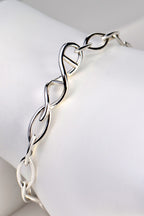 Sterling silver designer genes handmade bracelet with DNA helix link at the front and alternating elliptical links in 15mm and 12mm lengths. - Christine Sadler