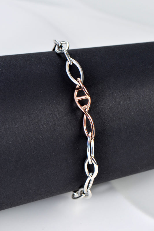 modern silver and rose gold bracelet design with a DNA link to represent a family bond