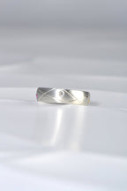 modern brushed silver ring set with a diamond from Christine Sadler's Afternoon Tea collection of jewellery