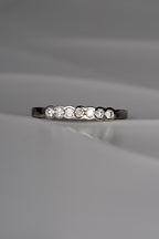 unusual modern platinum diamond set wedding ring with no claws handmade in the UK
