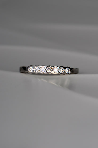 unusual modern platinum diamond set wedding ring with no claws handmade in the UK