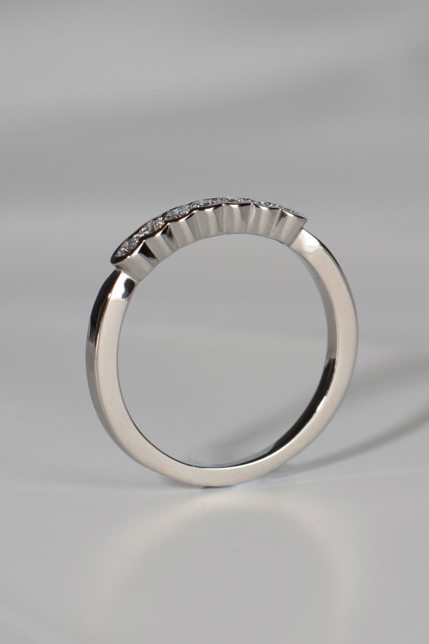 Narrow platinum diamond set wedding ring