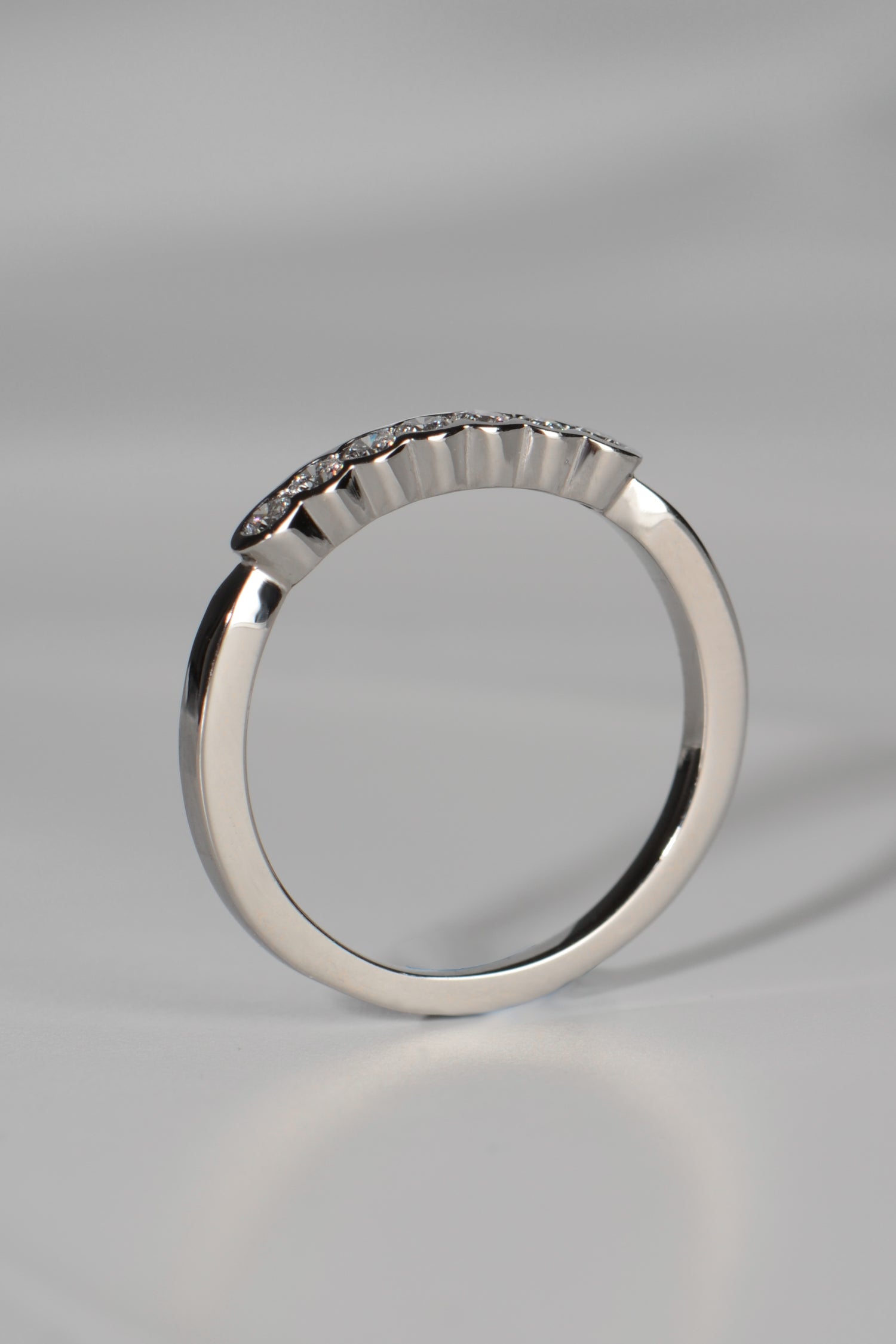 modern platinum and diamond narrow wedding ring for a woman