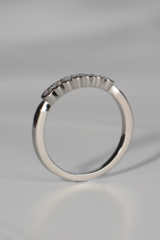 modern platinum and diamond narrow wedding ring for a woman