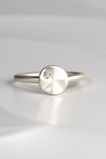 modern handmade silver ring with a ripple circle on top set with a diamond by Christine Sadler - jewellery to change the world