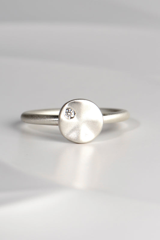modern handmade silver ring with a ripple circle on top set with a diamond by Christine Sadler - jewellery to change the world