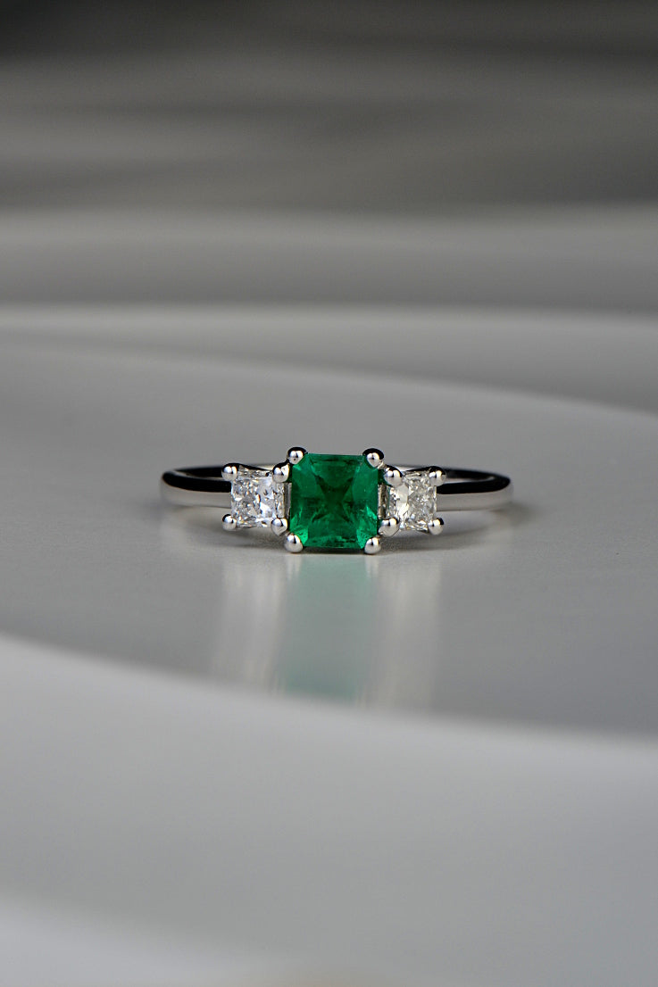 square cut emerald three stone ring with princess cut diamonds one of a kind