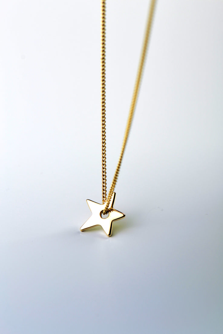 Falling star petite gold necklace