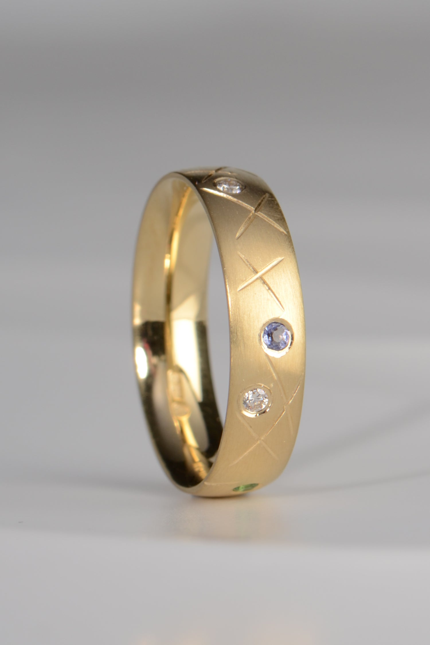 18ct yellow gold tanzanite and diamond ring inspired by 100's and 1000's sprinkles that you can choose your own gemstone colours and design your own ring by jewellery designer Christine Sadler