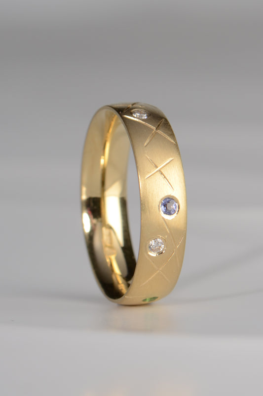 18ct yellow gold tanzanite and diamond ring inspired by 100's and 1000's sprinkles that you can choose your own gemstone colours and design your own ring by jewellery designer Christine Sadler
