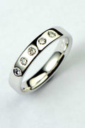 Modern 18ct white gold wedding ring for a woman set with five diamonds by contemporary jewellery designer Christine Sadler