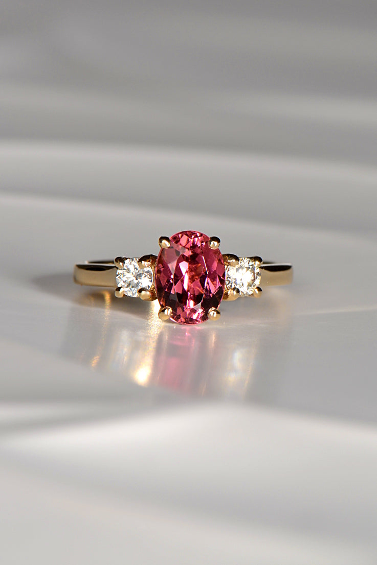 Fuchsia pink oval cut tourmaline and diamond ring