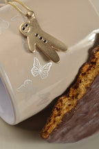 Gingerbread baby pendant gold - NecklacesChristine Sadler