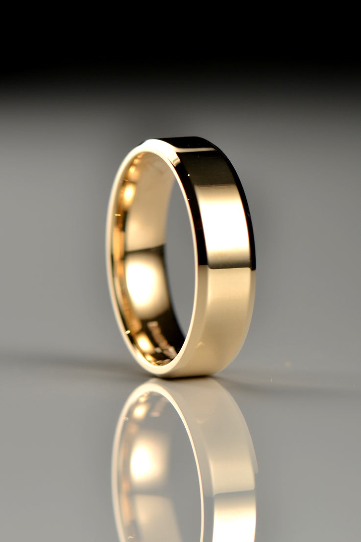 modern yellow gold gents wedding ring 6mm wide with chamfered edge detail