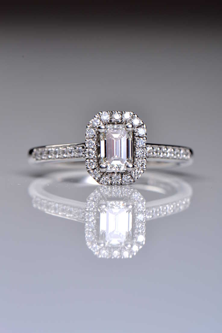 Platinum emerald cut diamond halo ring